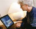Mature woman using MAGic screen magnification software